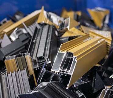 aluminium profile scrap in blue container