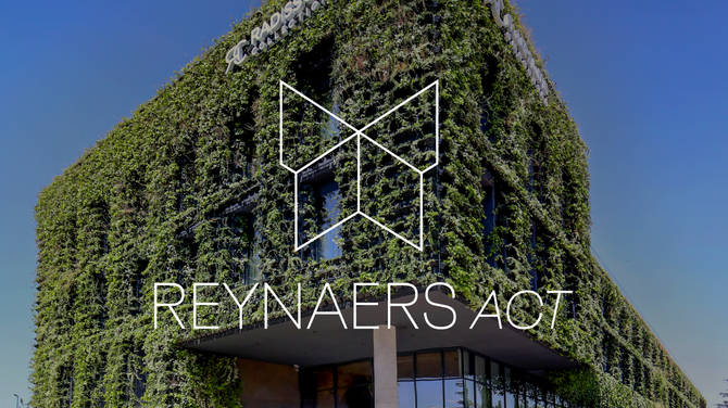 Reynaers Act logo in front of green building facade.