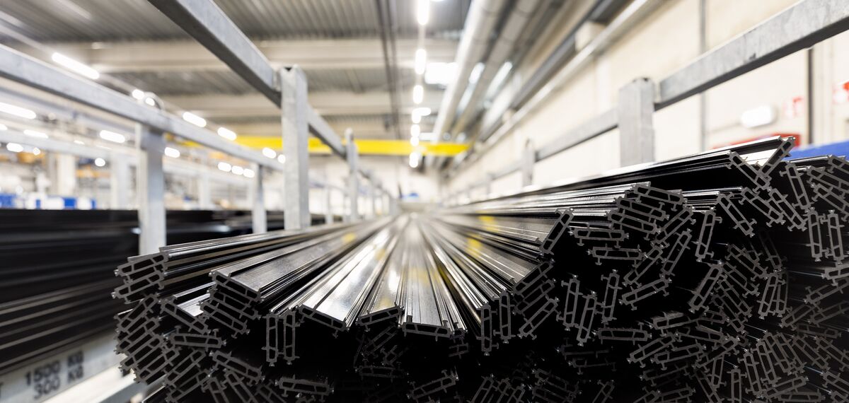 Synthetic thermal strips stacked in iron chassis in warehouse.
